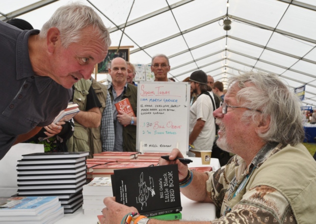 Birdfair 2015 at Rutland water. One of the celebrities at the event Bill Oddie signing book for Anthony Skyrme