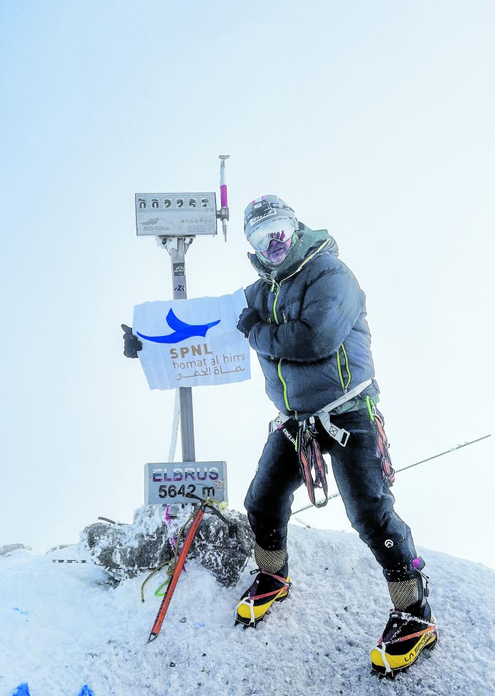 Hamada Malaeb raising the SPNL flag on Mount Elbrus summit Hamada Malaeb raising the SPNL flag on Mount Elbrus summit